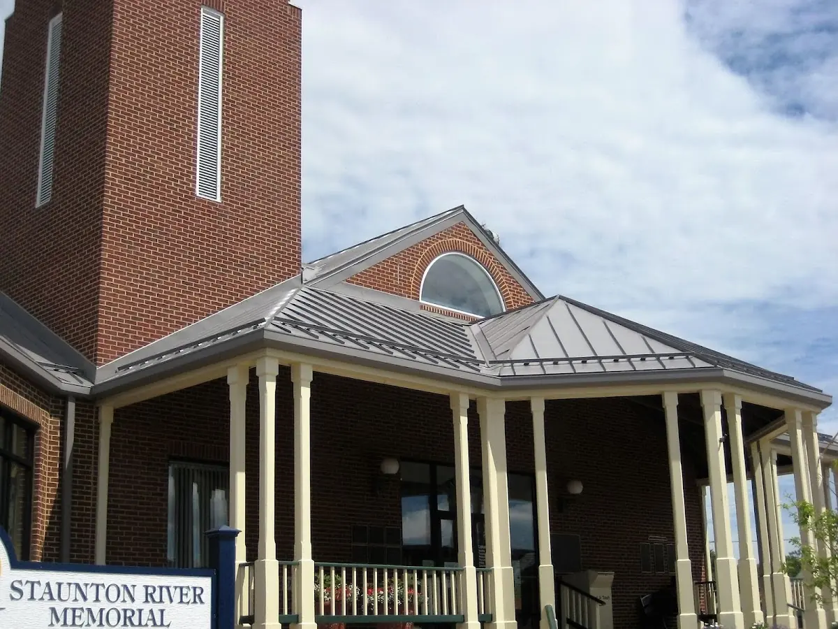 Skilled roofing craftsmen working on a residential roof in Hayti